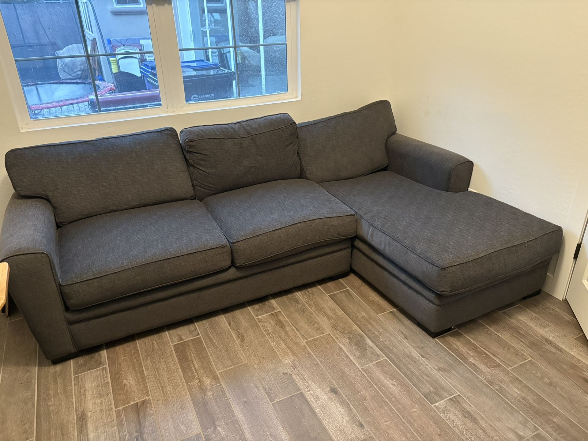 Grey Couch With Chase and Pull Out Mattress