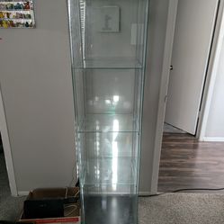 Glass display case. Great Condition. A little dusty