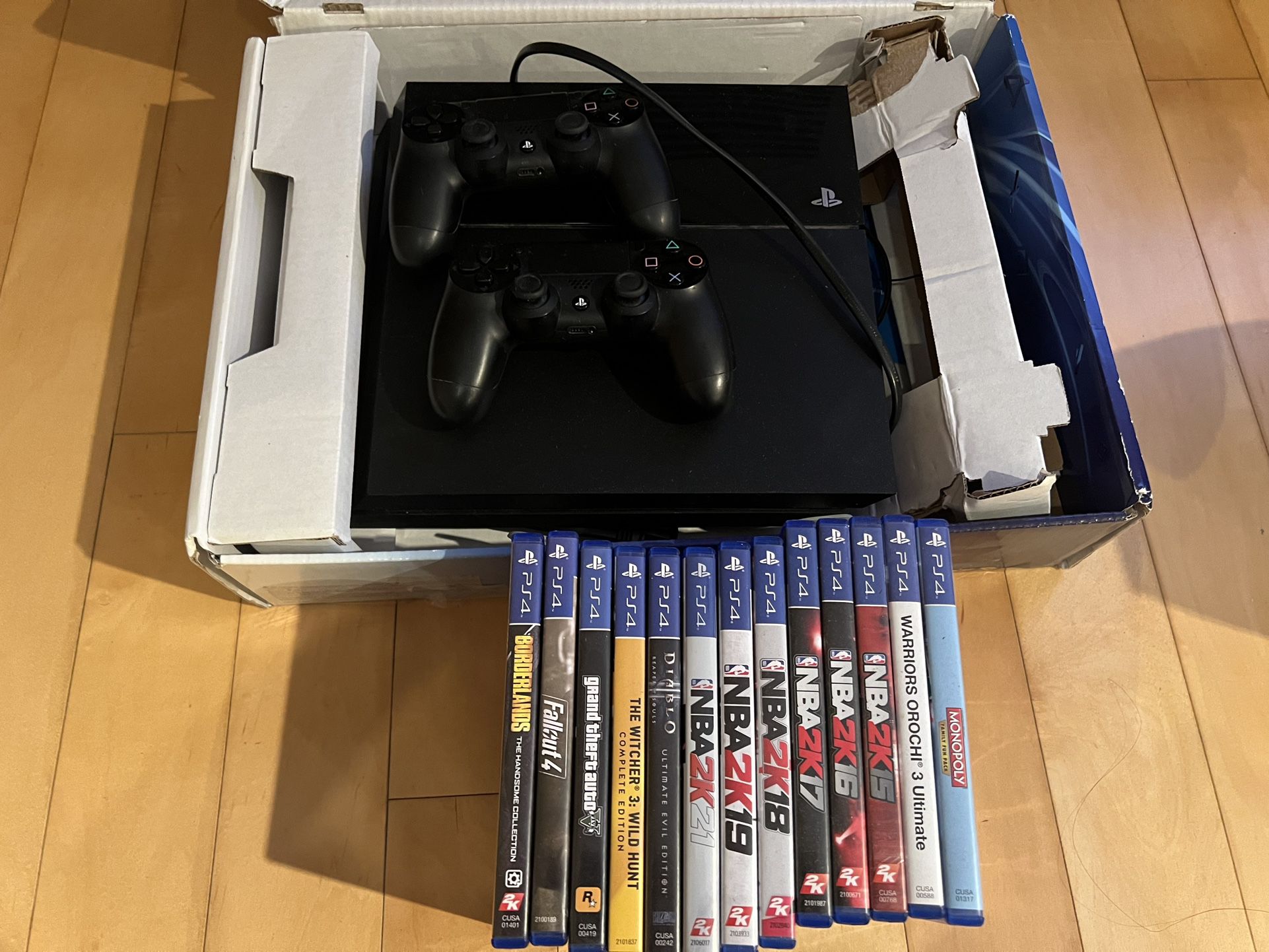 PS4 with 2 Controllers and 13 Games