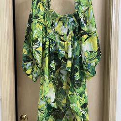 New adorable women’s size medium high low blouse. Tropical print. Never worn.  Too big 