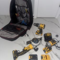Dewalt package deal brushless grinder, three drills, five batteries, one charger, Husky, heavy duty book bag with levels, tools, measuring tape, eetc.
