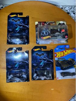 Lot of four Hot Wheels 9-Car Gift Packs, featuring a variety of die-cast vehicles. Great for collectors, gifts, or anyone looking to add multiple cars