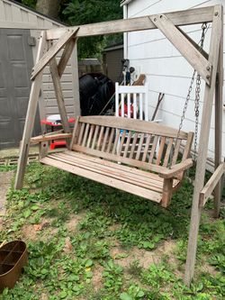 Outdoor wood swing ( I believe is cedar ) pick up asap