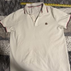 White Moncler polo shirt Size mens L(measurements provided in pictures) 10/10 condition no flaws, worn once. NFC tag works in the logo Authentic  Clic