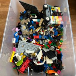 Bin of legos and small legos from star wars, ninjago and more