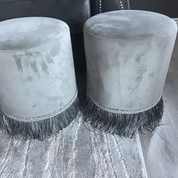 Two Gray Round Velvet Upholstered Ottoman. 