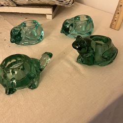 Four Indiana glass votives.