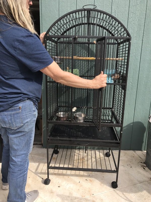 Bird cage with roller wheels