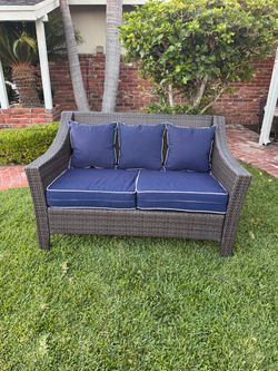 Outdoor Wicker Loveseat with Navy Cushions