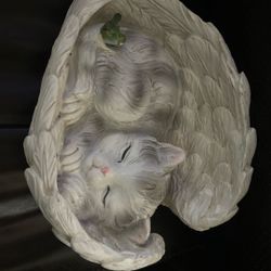 Angel sleeping kitty with little green Birdie