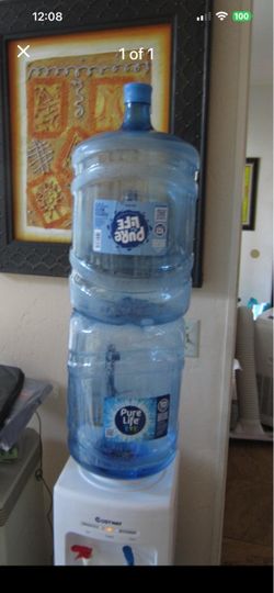 2 recently emptied 5 gallon water bottles