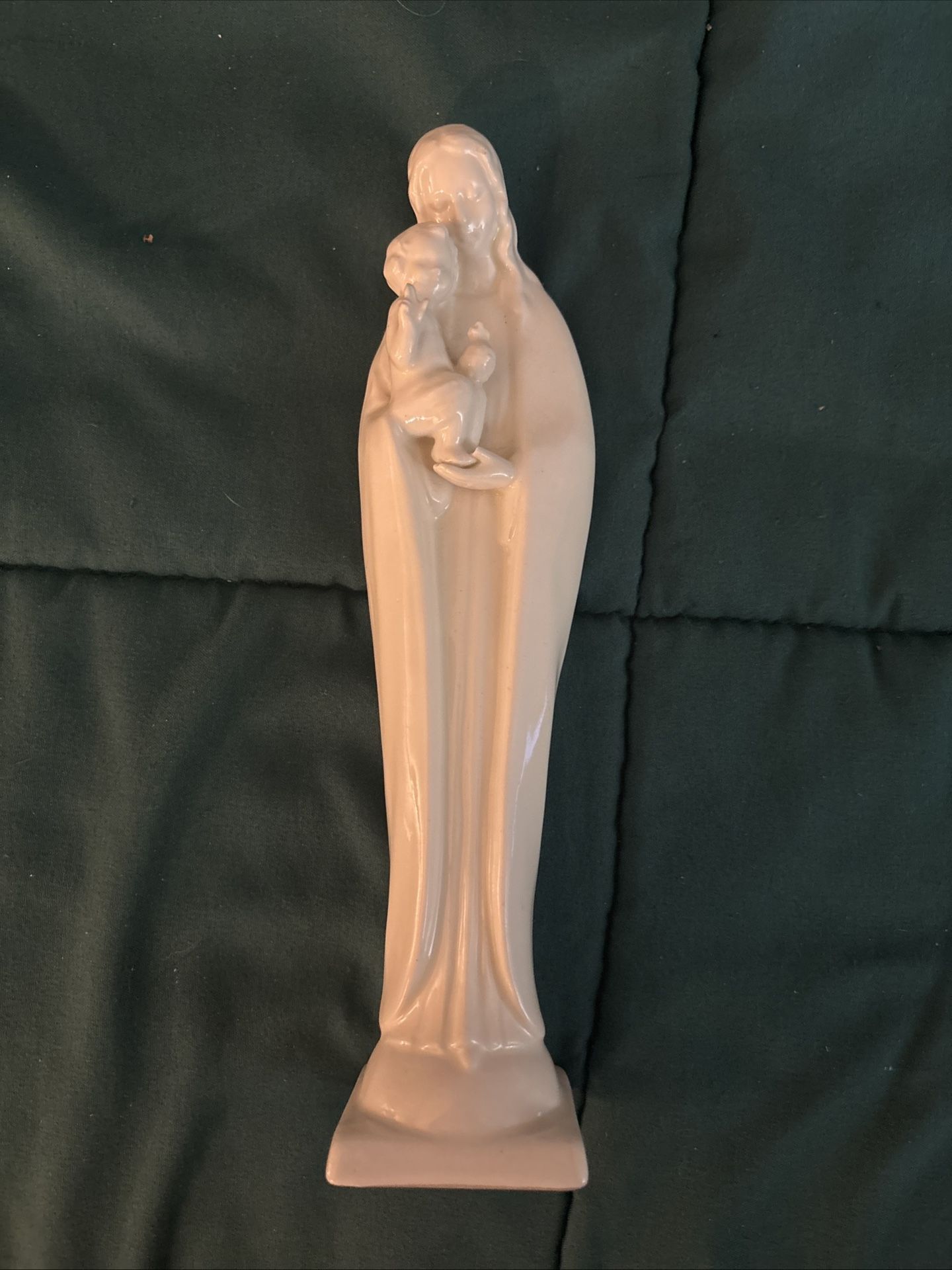 Vintage Goebel Hummel Madonna figurine featuring the Virgin Mary and Jesus in white porcelain. This 10 1/2-inch tall figurine, manufactured in the 50s