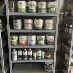 Shelf And Paint All Together Most Are Full Of Paint