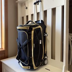 wheeled water proof luggage 25"Hx14"Wx13"D (expandable)