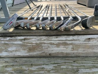Set of golf clubs.  Mainly Wilson