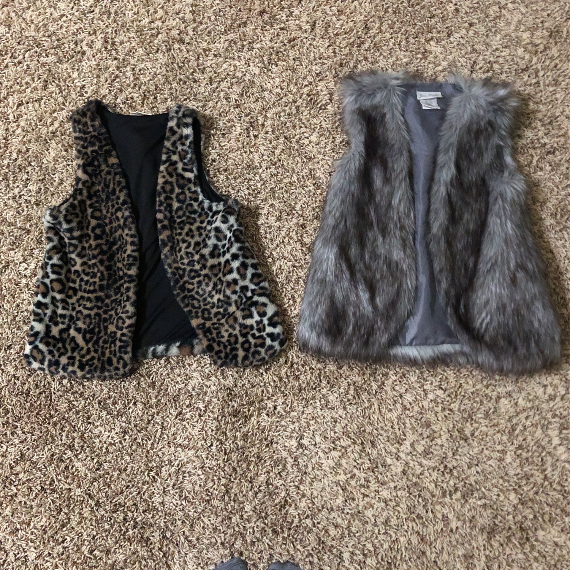 Two Fur Vests 1 Leopard Pattern The Other Wolf Patter