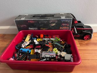 Hot wheels truck and box of cars