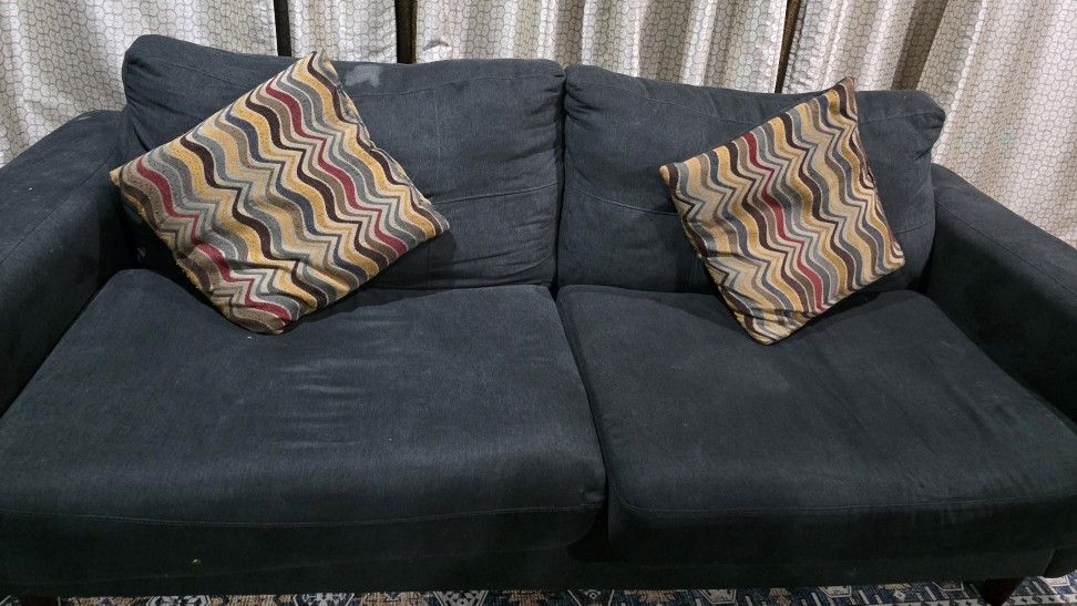 Two Sofas With Pillows and Lift Top Coffee Table