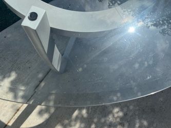 48” round beveled glass table top with stand. Dining room