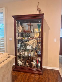 TWO locking (with key) wooden china hutches with glass back, glass shelves, and built in lights