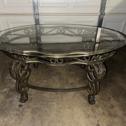Oval Glass Coffee Table with Decorative Metal Base