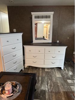 Accessible beige dresser, with mirror, a tall dresser and a full-size bed frame with yours