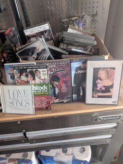 Box of CDs and DVDS