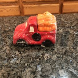 Red Truck Pair Of Salt And Pepper Shakers .  Size 2 1/2 inches Tall And 4 inches Long.  Brand New Never Opened Factory Sealed 