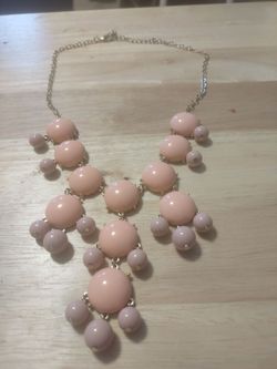 This is a vintage bubble pink necklace