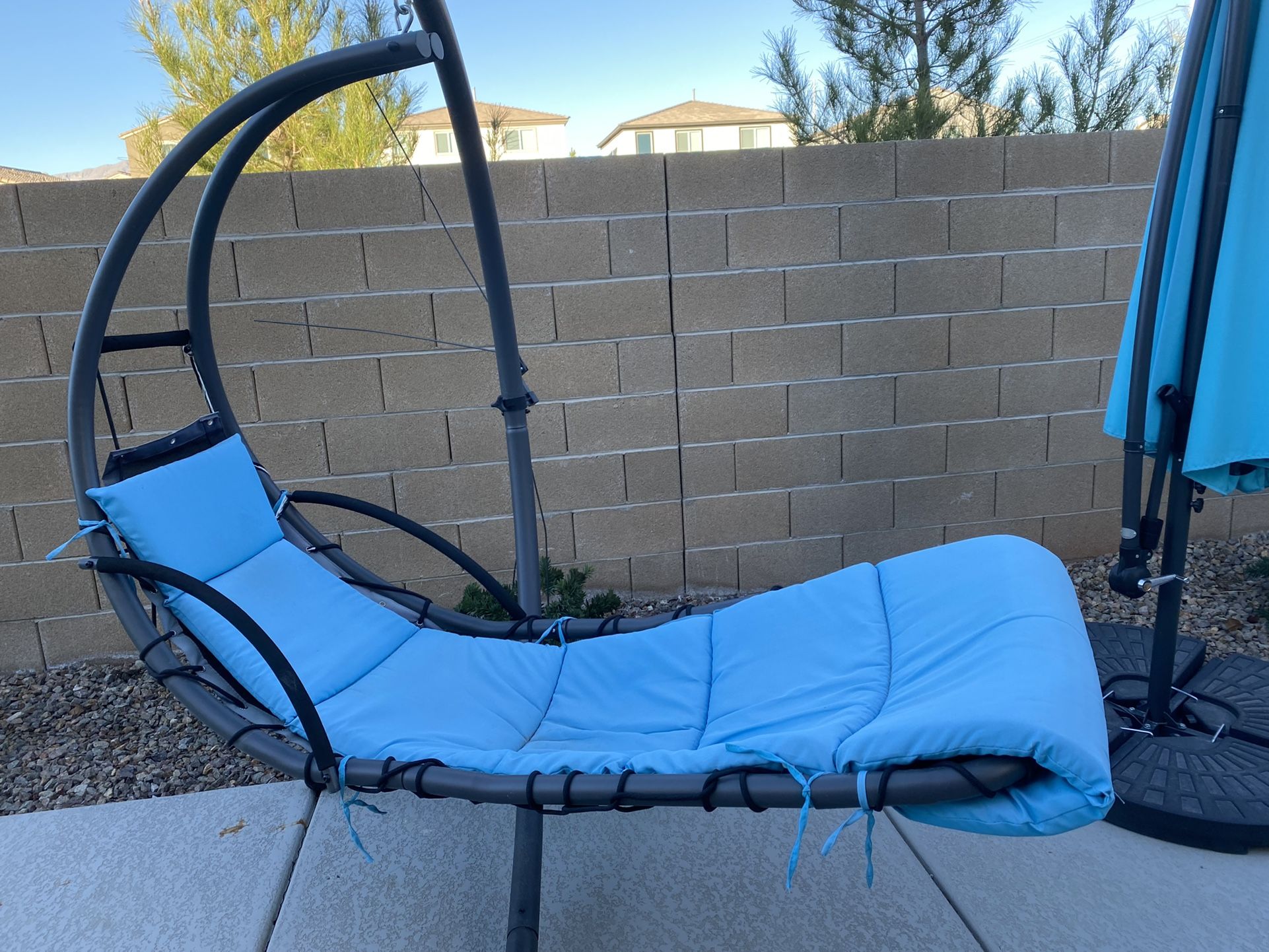 Two Blue Hanging Chairs $150 Each Umbrella Is $85