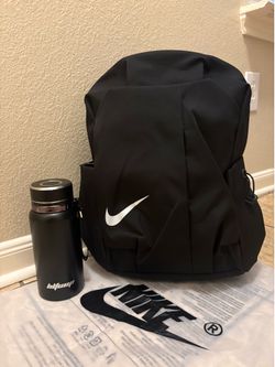 Black Nike backpack with cup