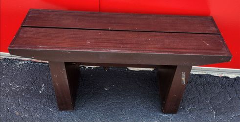 Dark brown wooden bench