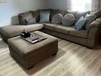Grey sectional couch with ottoman