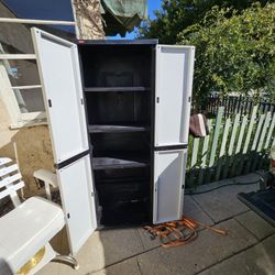 Keter outdoor shed cabinet, with shelves, good condition.  Must cut lock off