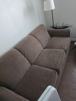 Brown three seater couch