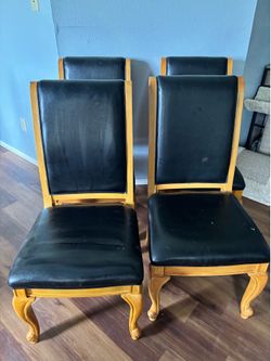 4 high backed over sized chairs with leather seat and backs