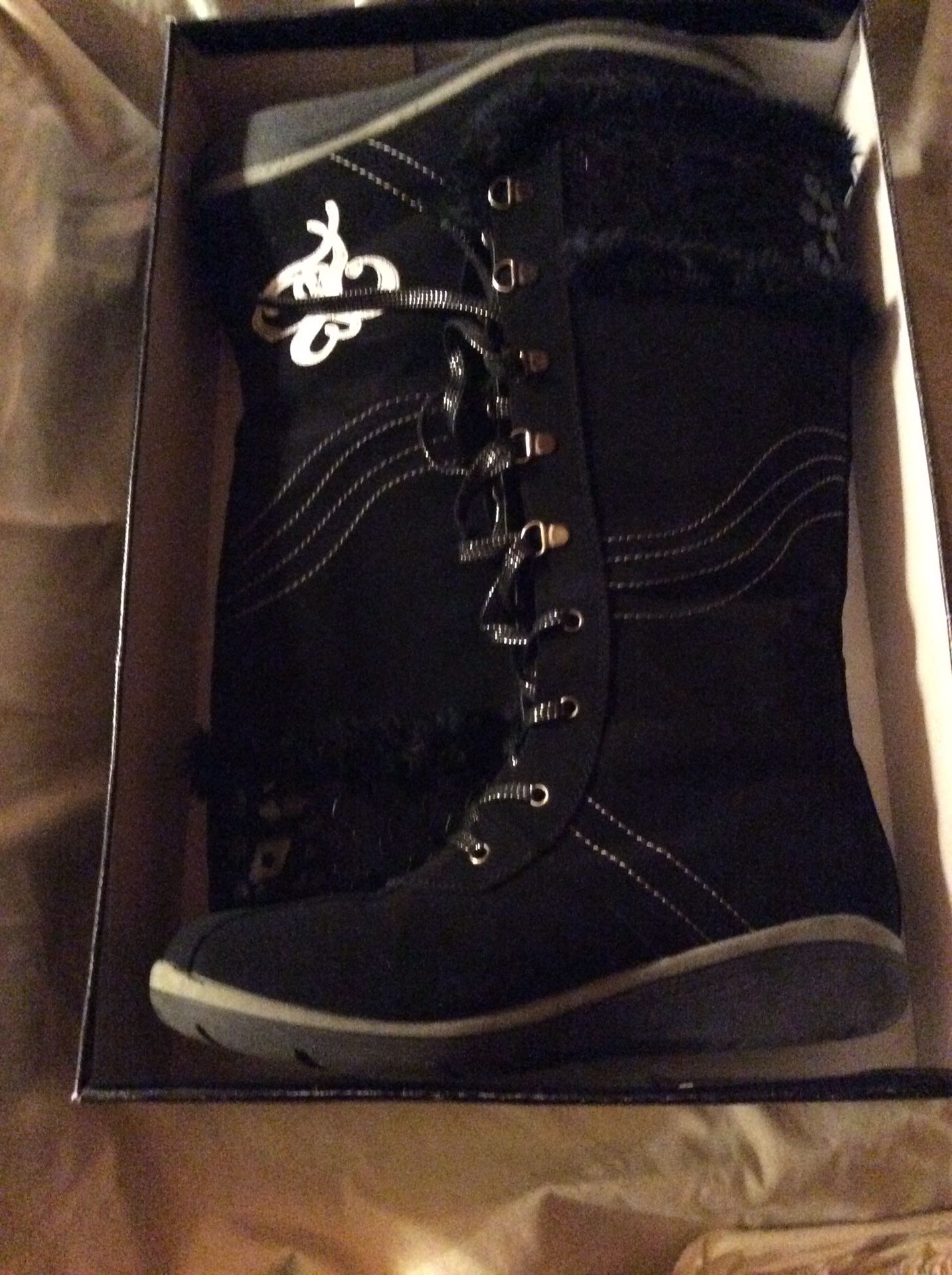 Women’s black boots, size 9.5.