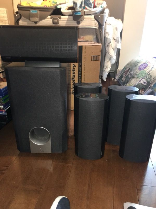 Onkyo surround sound speakers, including subwoofer and color coded wires.