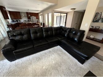 Black faux leather L-shape sectional couch