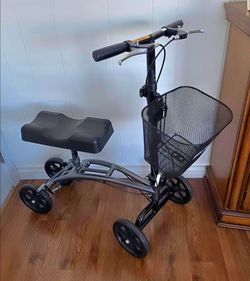 KNEE WALKER/SCOOTER: FOLDABLE, ADJUSTABLE, DUAL HAND BRAKES, BASKET. GREY FRAME. EXCELLENT CONDITION!