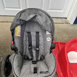 Graco car seat and 2 bases, plus pull sled