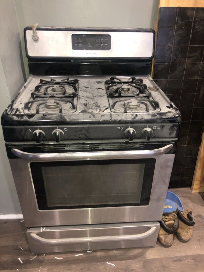 Stainless steel fridge and over range microwave and stove