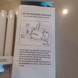 Brand new never used twenty seven watt, One twenty volt a c compact fluorescent