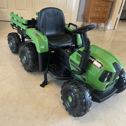 Toddler ride on remote controlled tractor with tow  behind . NEW