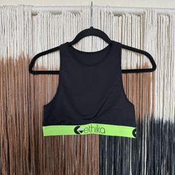 Black Ethika high neck performance style sports bra with neon green accents; perfect condition