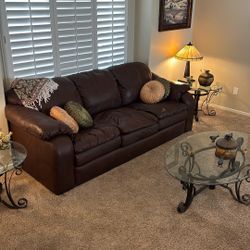 Wooden Table With Four Chairs, Leather Couch, Two Upholstery Chairs, Curio Cabinet. See Description all items.$500.00 Takes It All.