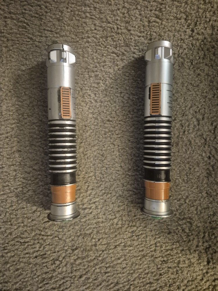 Pair of green lightsabers