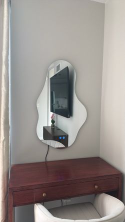 Wavy mirror with backlight