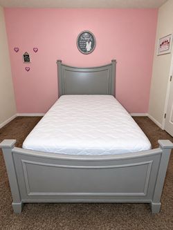 Grey twin size bed and mattress