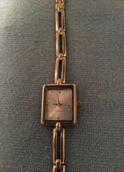 Silver tone square watch